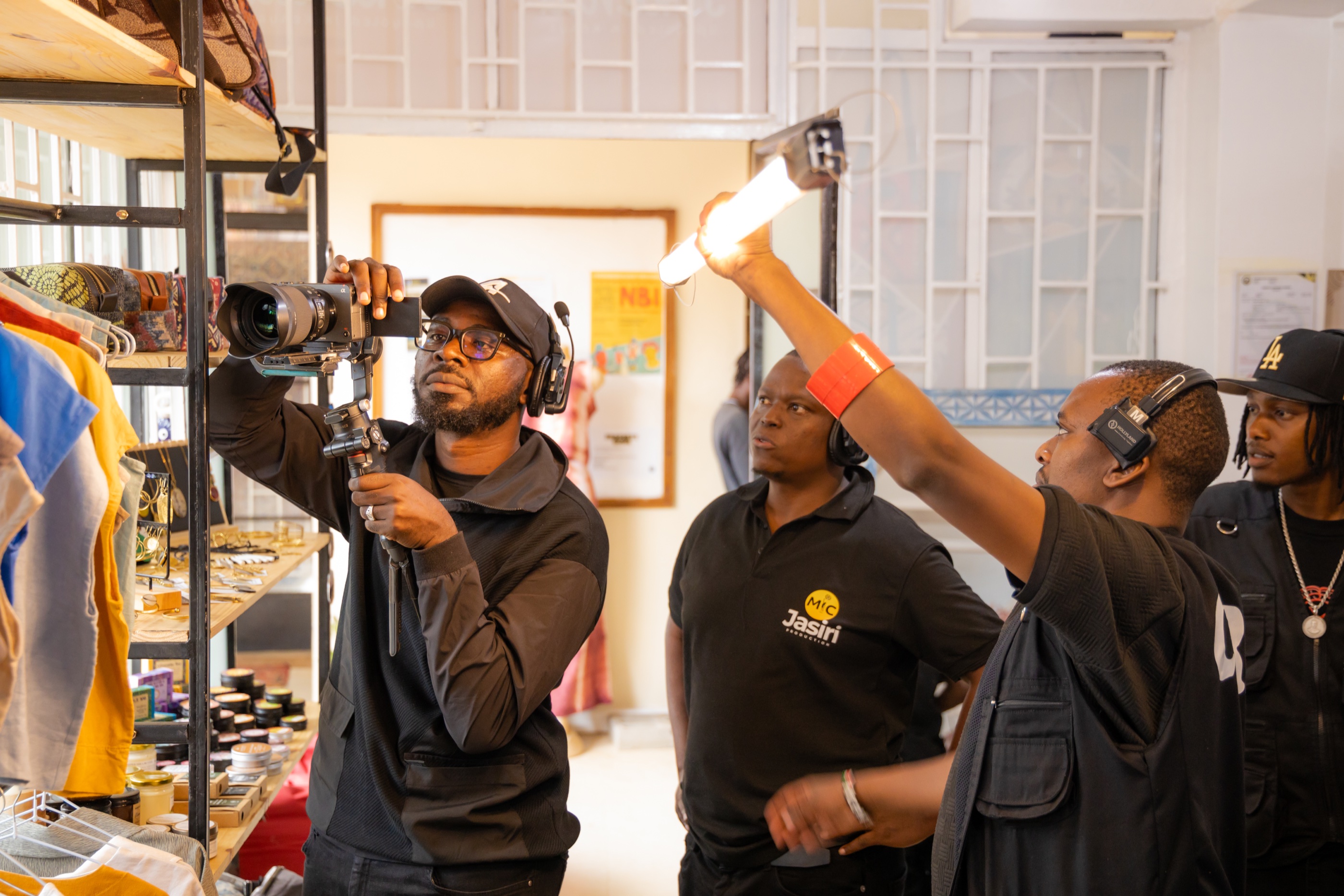 Mic-Jasiri crew lighting and filming a retail scene