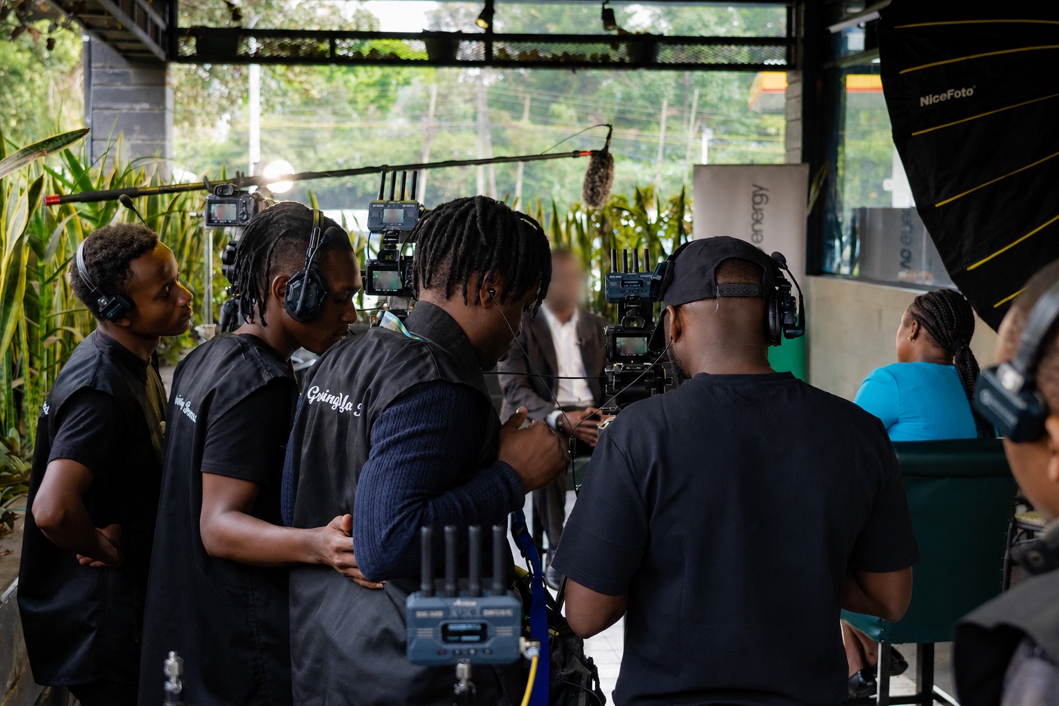Mic-Jasiri crew filming an anonymized interview subject